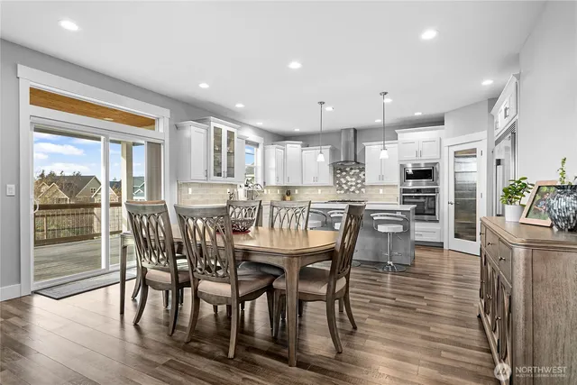 a view of a dining room with furniture window and wooden floor