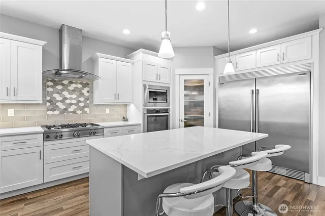 a kitchen with a table and chairs