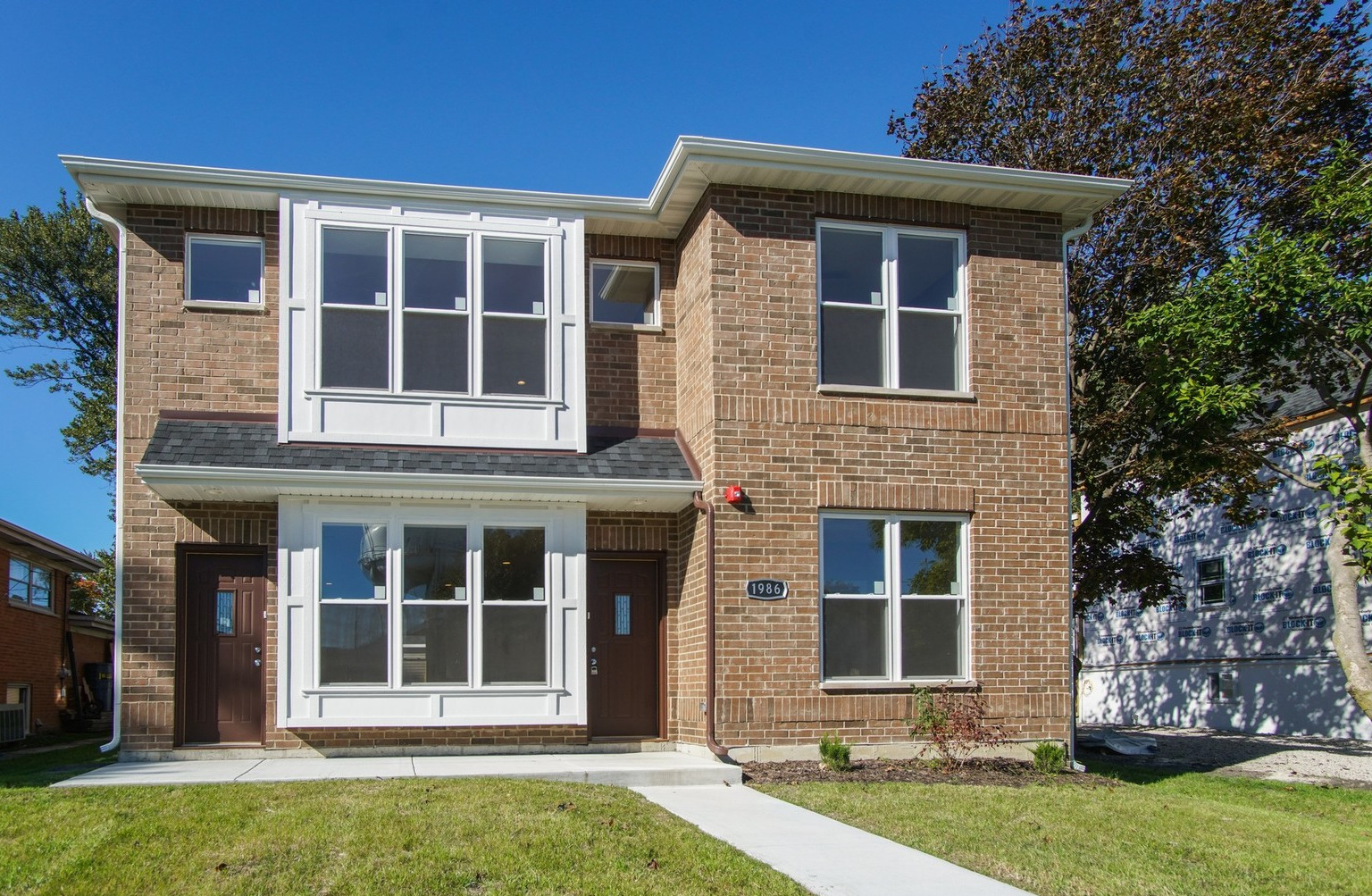 1986 Pine Street, Unit 1 Des Plaines, IL 60018 - Photo 1 of 11 front view of a house with a yard
