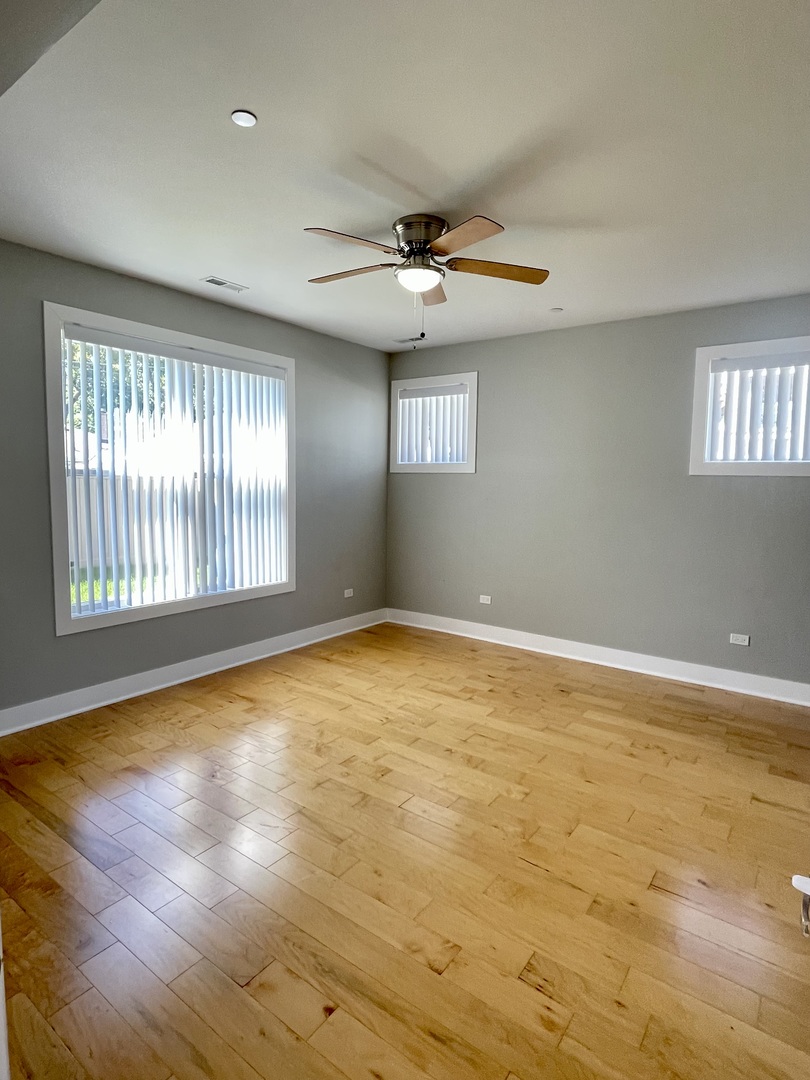 1986 Pine Street, Unit 1 Des Plaines, IL 60018 - Photo 6 of 11 an empty room with windows