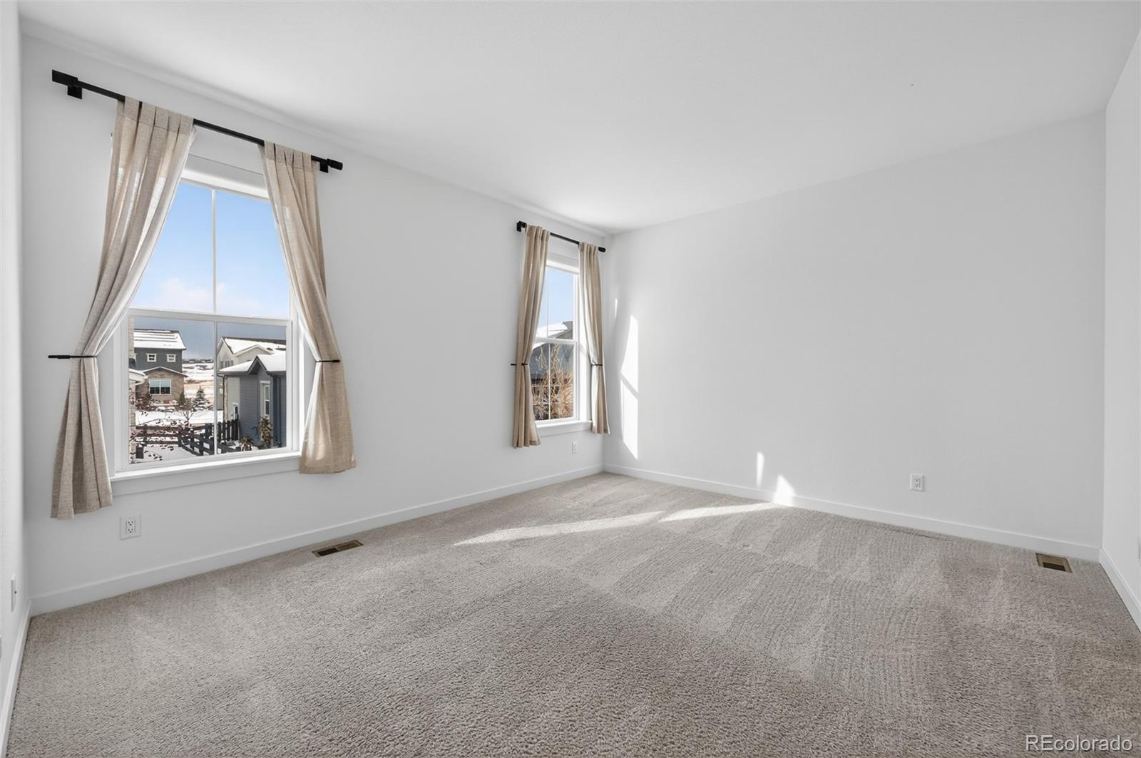 6311 Stable View Street Castle Pines, CO 80108 - Photo 13 of 46 an empty room with a window