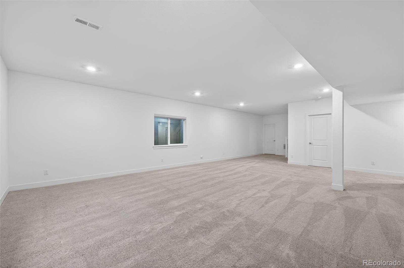 6311 Stable View Street Castle Pines, CO 80108 - Photo 30 of 46 an empty room with a empty space and windows