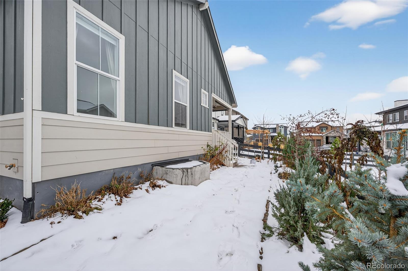 6311 Stable View Street Castle Pines, CO 80108 - Photo 38 of 46 a view of a house with a backyard