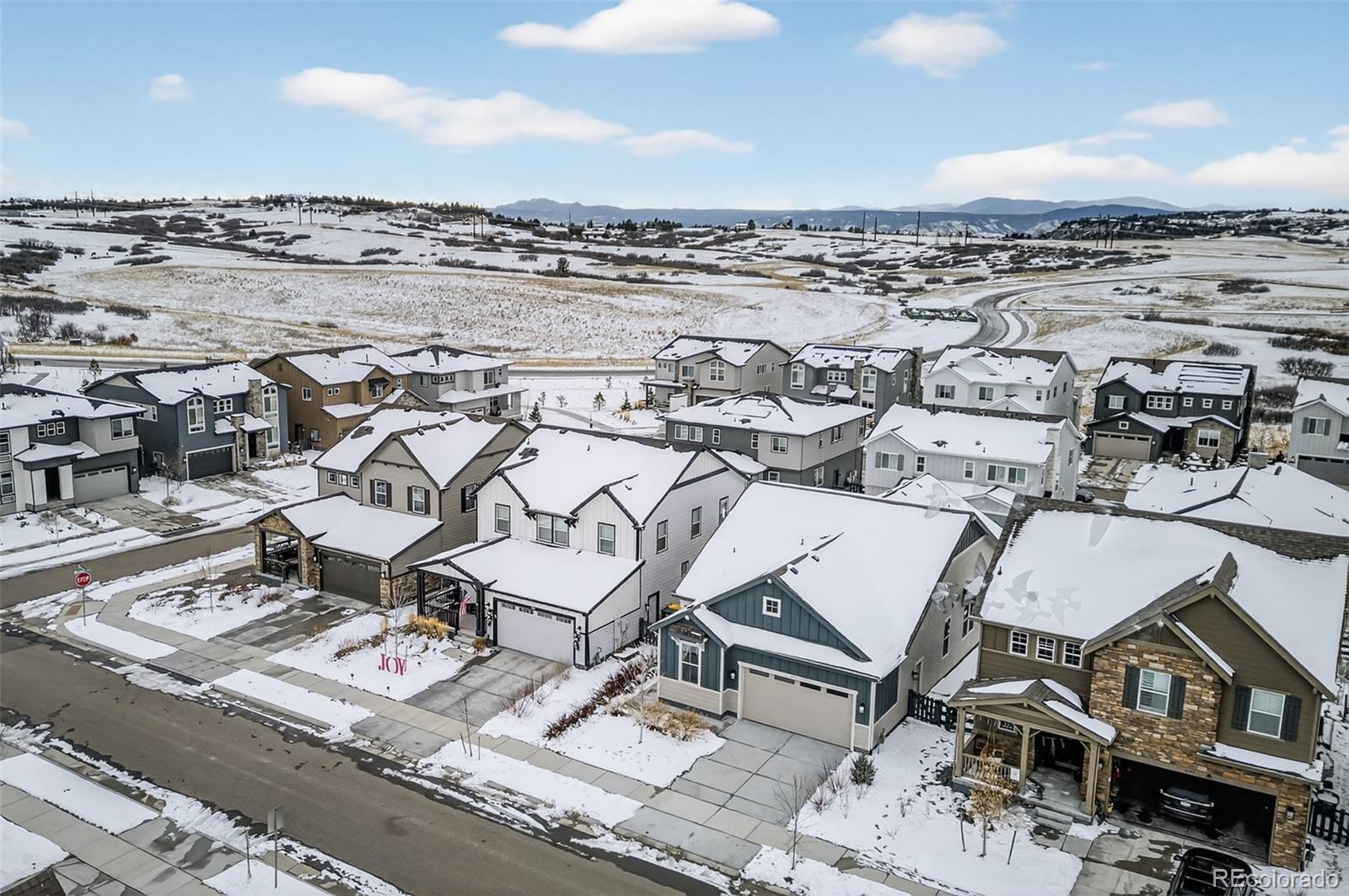 6311 Stable View Street Castle Pines, CO 80108 - Photo 40 of 46 an aerial view of a residential building with terrace