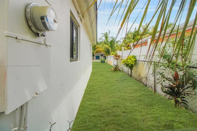 a view of a yard from a balcony
