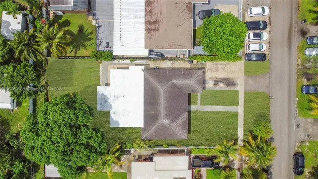 aerial view of a house with a garden and plants