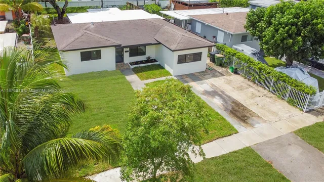 an aerial view of house with yard