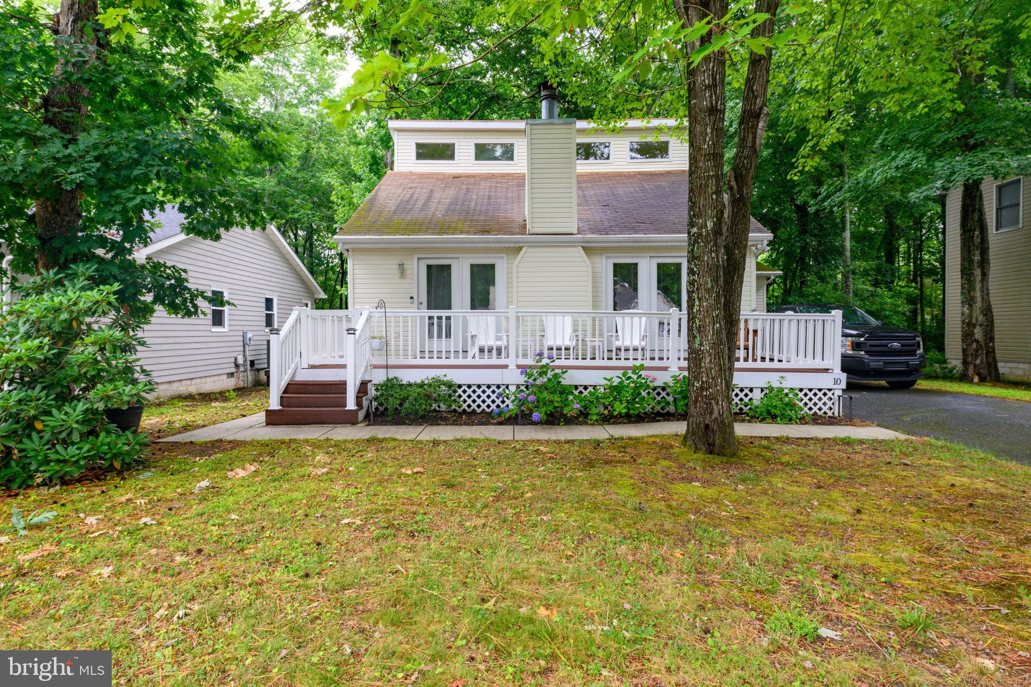 10 Gloucester Road Ocean Pines, MD 21811 - Photo 1 of 37 a house with swimming pool in front of it