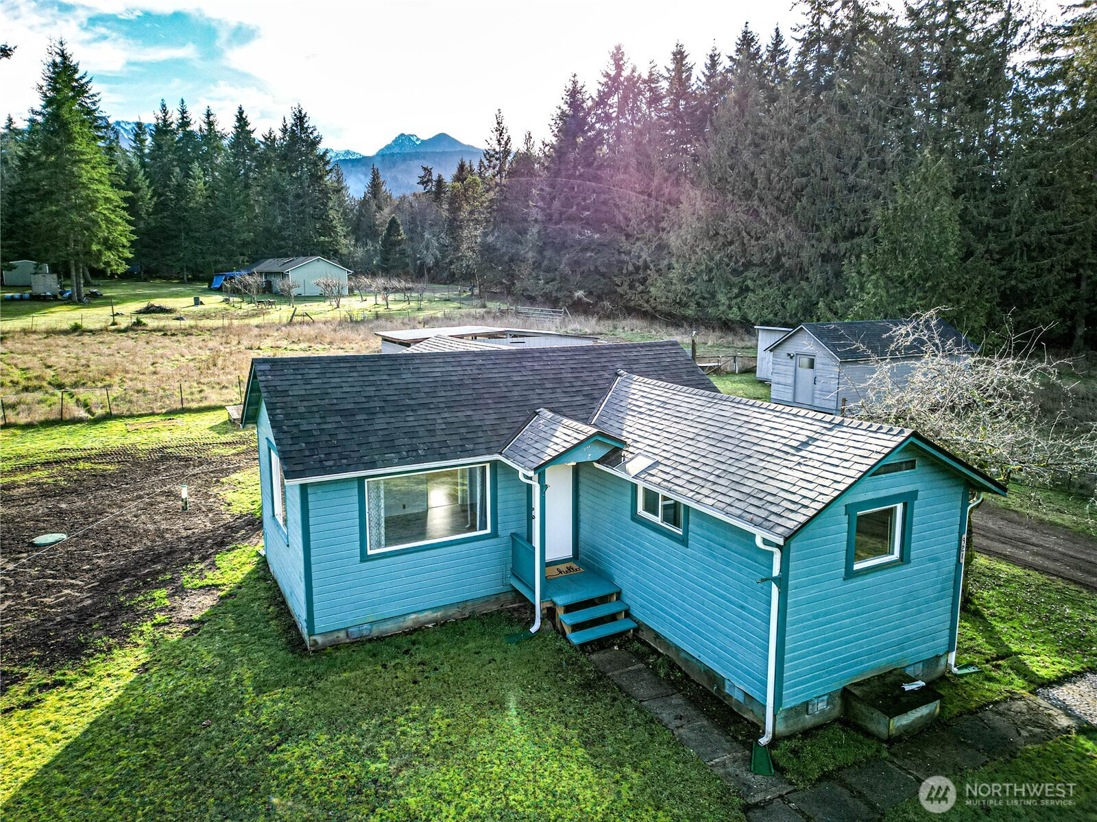 1520 Scrivner Road Port Angeles, WA 98362 - Photo 30 of 40 a aerial view of a house with a yard and large trees
