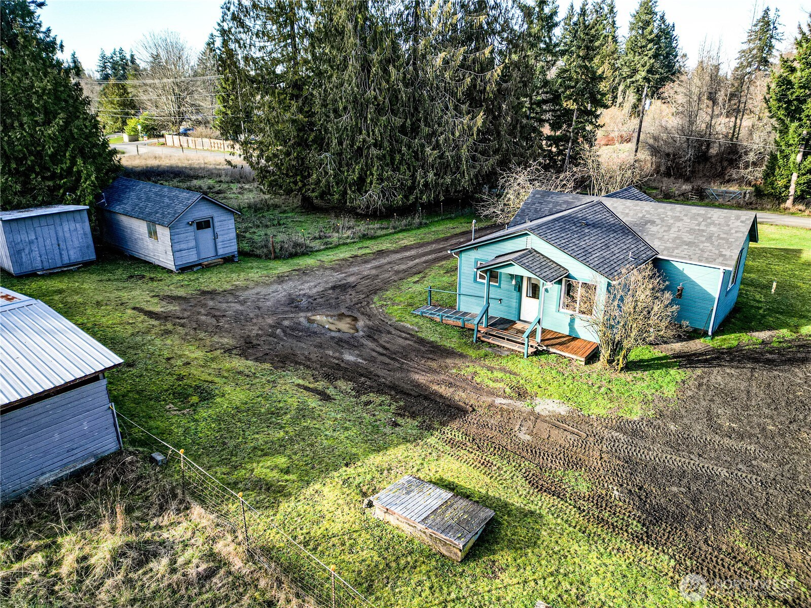 1520 Scrivner Road Port Angeles, WA 98362 - Photo 36 of 40 a aerial view of a house with a yard table and chairs
