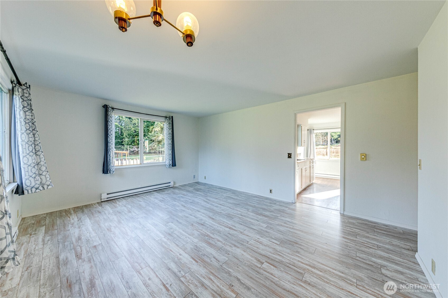 1520 Scrivner Road Port Angeles, WA 98362 - Photo 5 of 40 wooden floor in an empty room with a window
