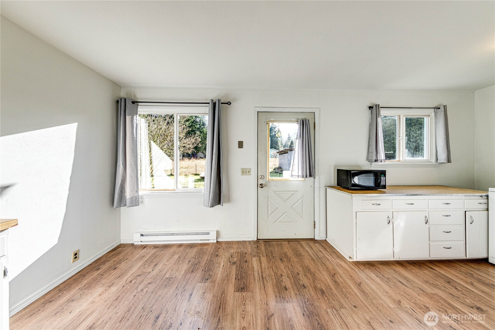 1520 Scrivner Road Port Angeles, WA 98362 - Photo 10 of 40 wooden floor in an empty room with a window