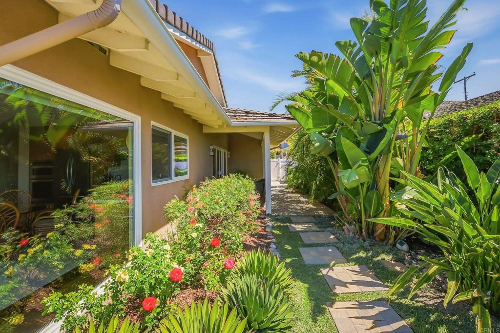 5958 Sagebrush Road La Jolla, CA 92037 - Photo 12 of 64 a front view of a house with a yard