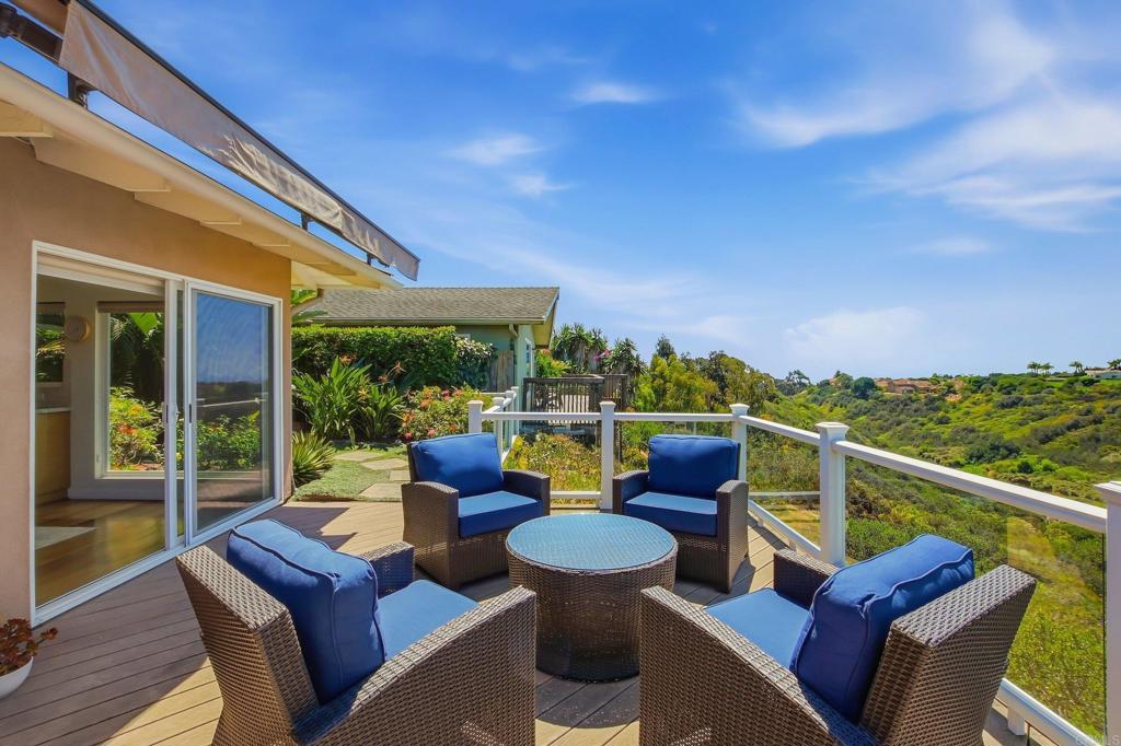 5958 Sagebrush Road La Jolla, CA 92037 - Photo 16 of 64 a view of a chair and tables in the balcony