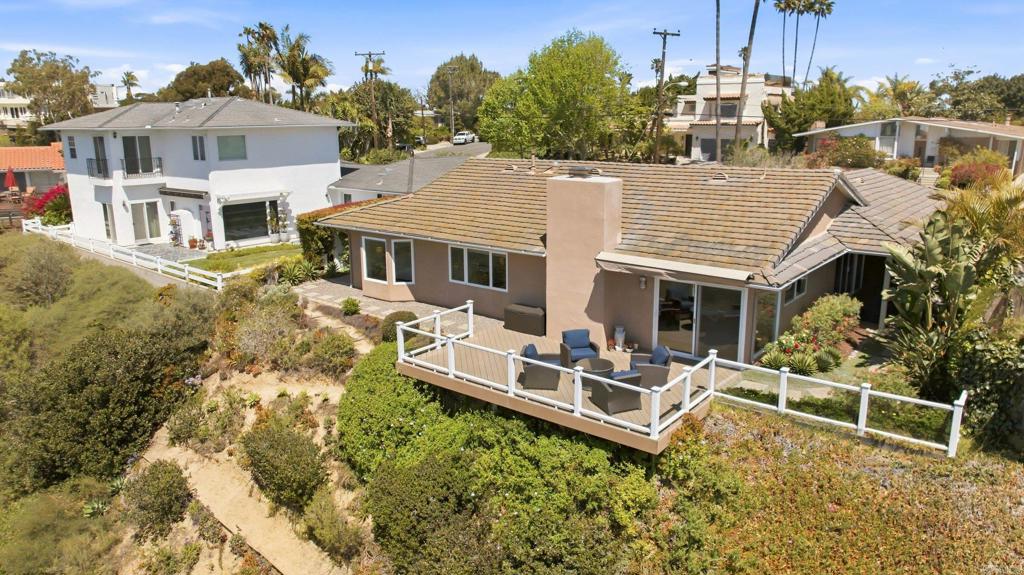 5958 Sagebrush Road La Jolla, CA 92037 - Photo 22 of 64 an aerial view of a house with a yard table and chairs