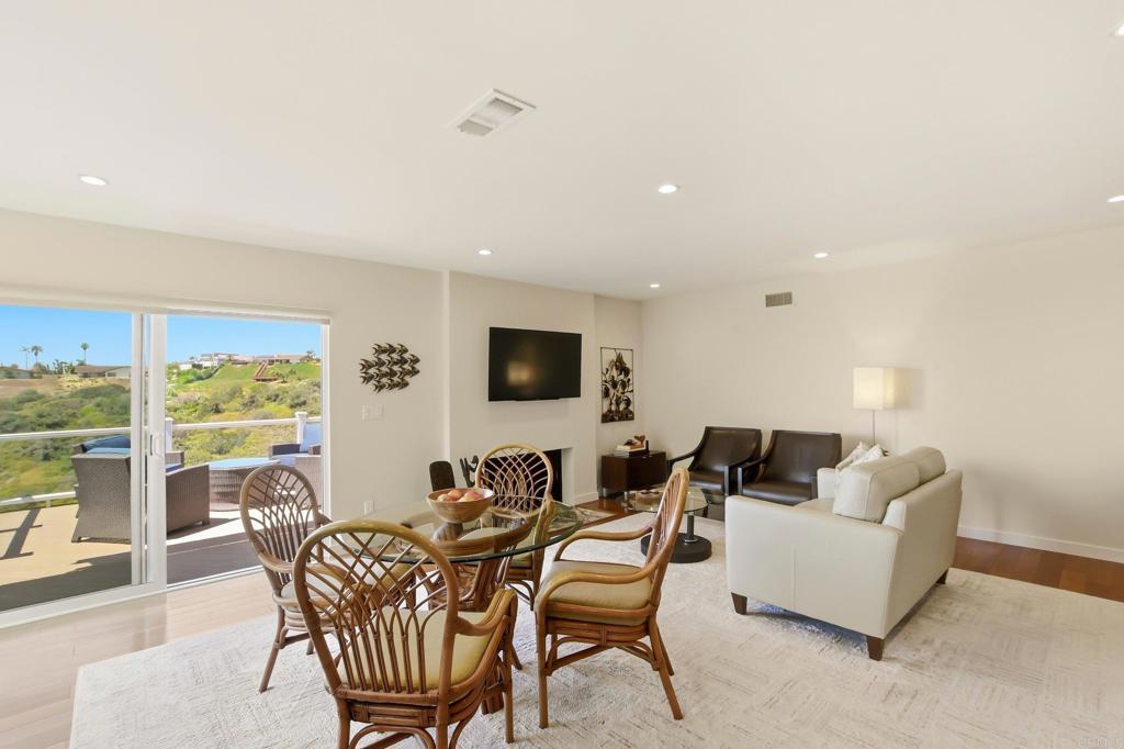 5958 Sagebrush Road La Jolla, CA 92037 - Photo 27 of 64 a living room with furniture and a flat screen tv