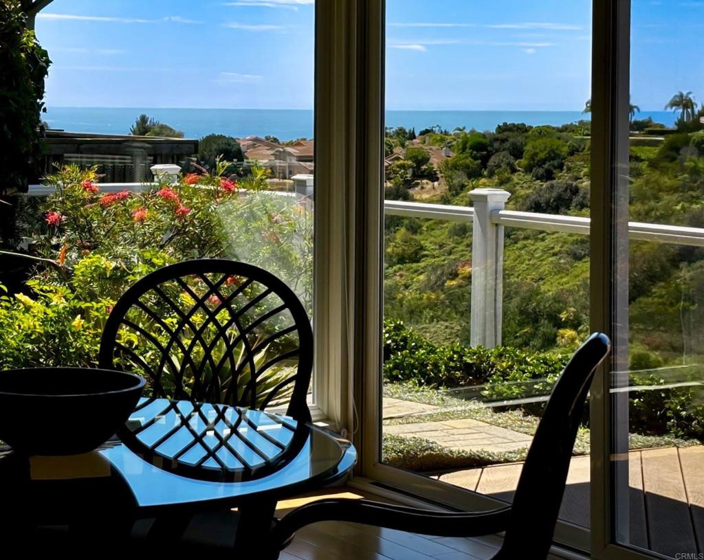 5958 Sagebrush Road La Jolla, CA 92037 - Photo 31 of 64 a view of a balcony with chair and tables