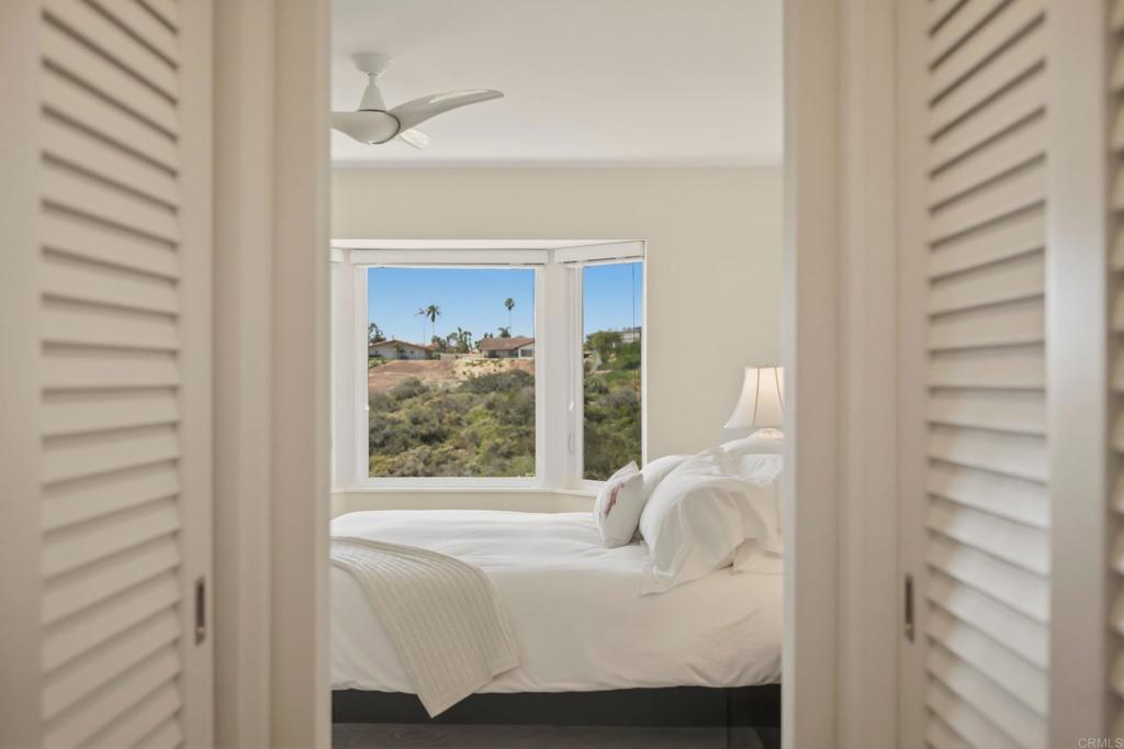 5958 Sagebrush Road La Jolla, CA 92037 - Photo 38 of 64 a bedroom with a bed and a window