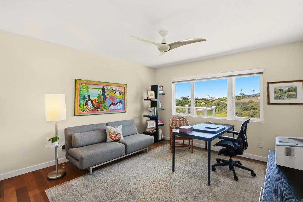 5958 Sagebrush Road La Jolla, CA 92037 - Photo 42 of 64 a living room with furniture a rug and a window