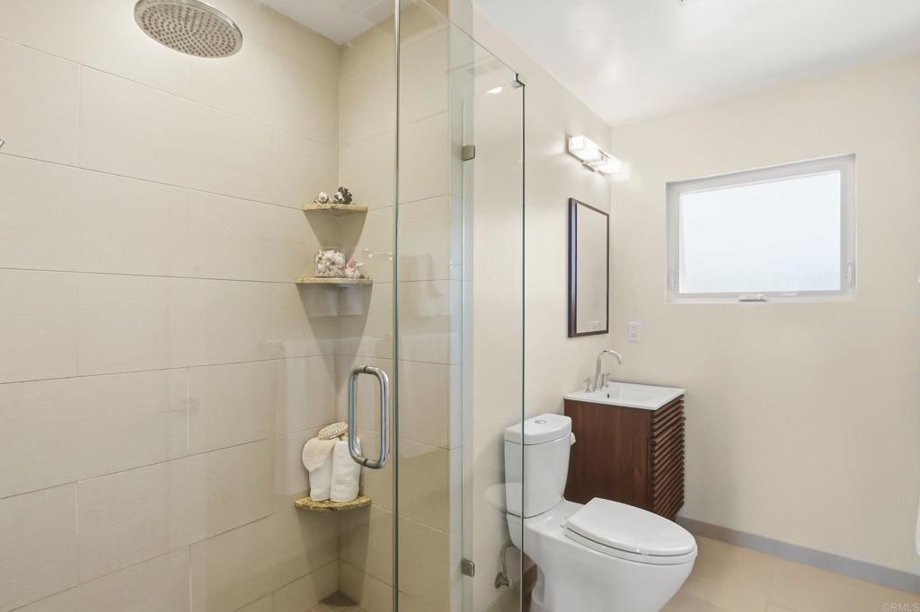 5958 Sagebrush Road La Jolla, CA 92037 - Photo 45 of 64 a bathroom with a toilet and a shower
