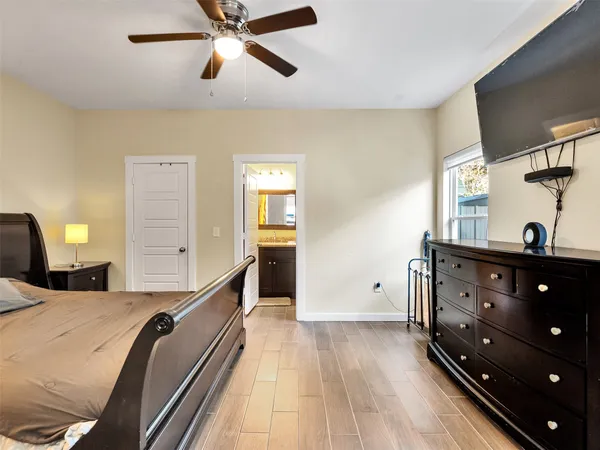 a bed room with a bed and a lamp