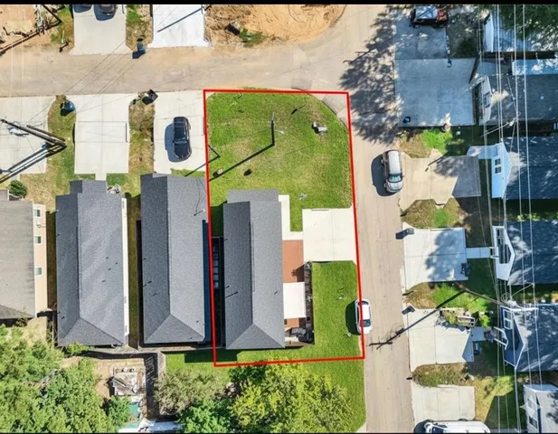 an aerial view of houses and roads