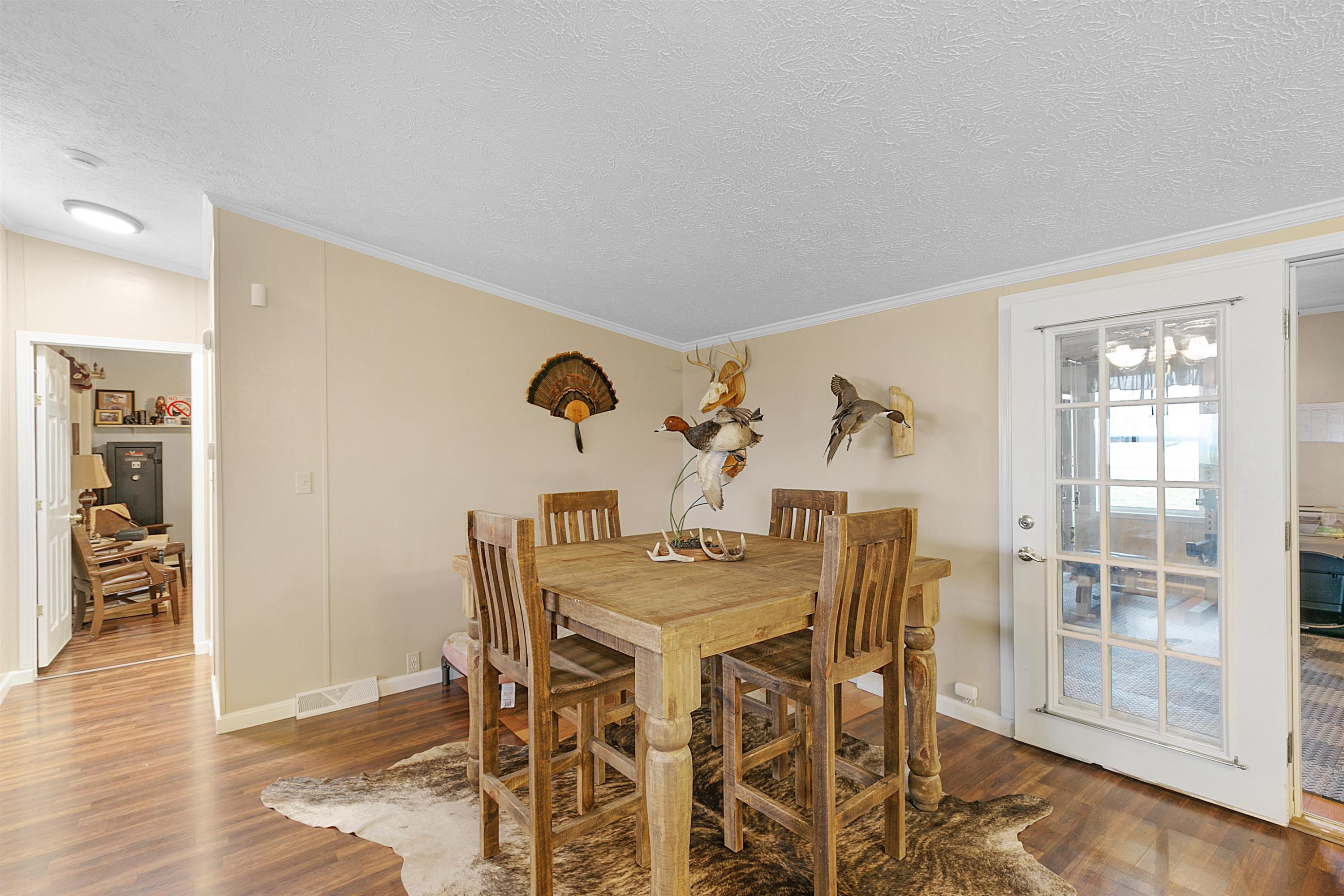 4022 Lower Jackson Road Bells, TN 38006 - Photo 8 of 18 a view of a dining room with furniture and wooden floor