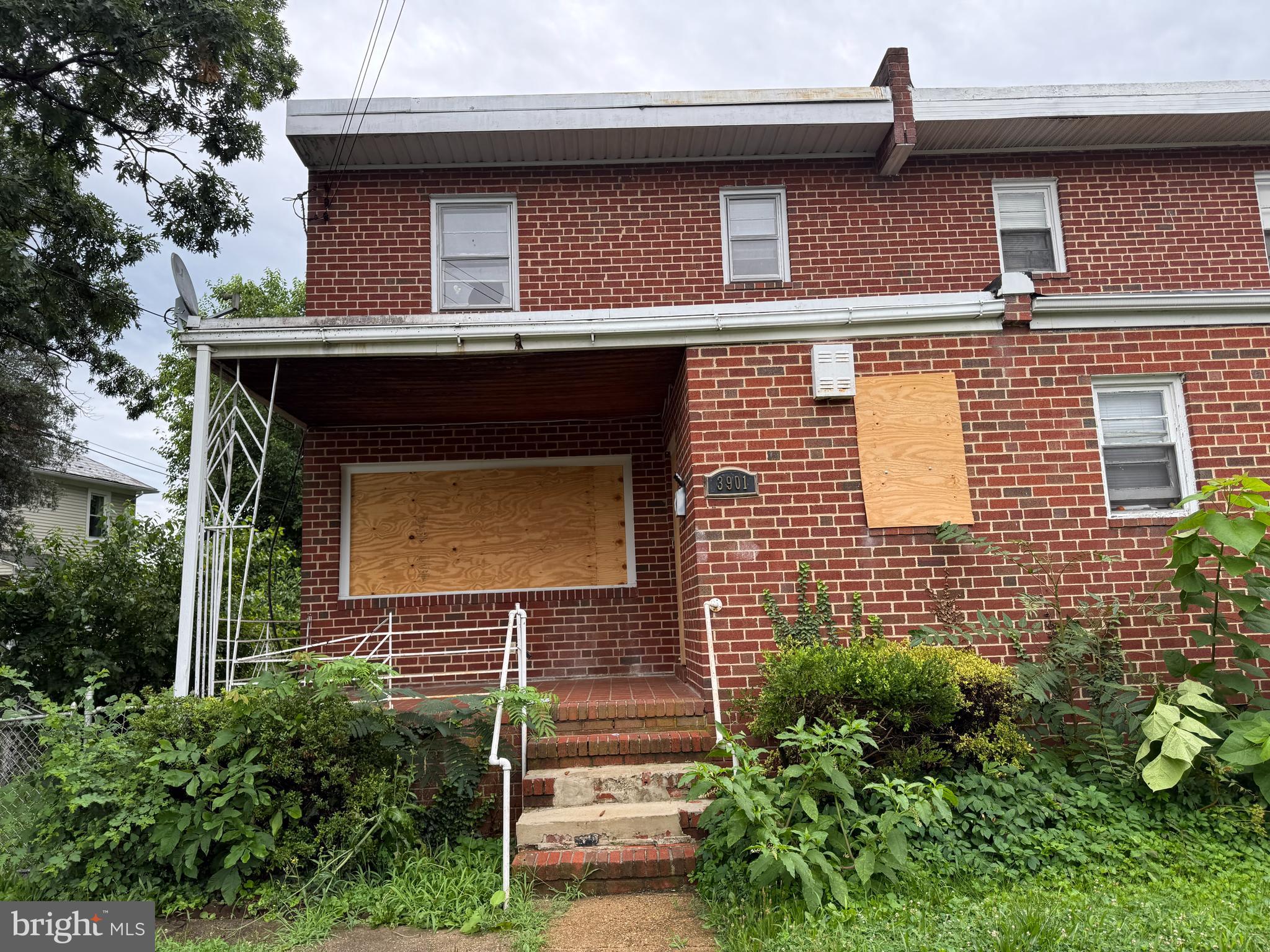 3901 Mortimer Avenue Baltimore, MD 21215 - Photo 20 of 21 a front view of a house with garden