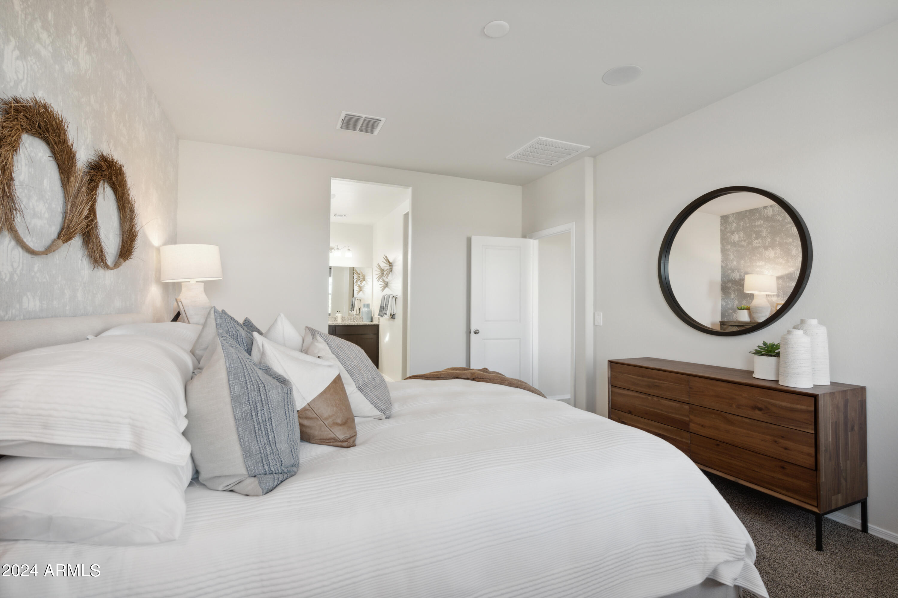 8522 West Gehrig Way Florence, AZ 85132 - Photo 13 of 46 a bedroom with a bed and a mirror