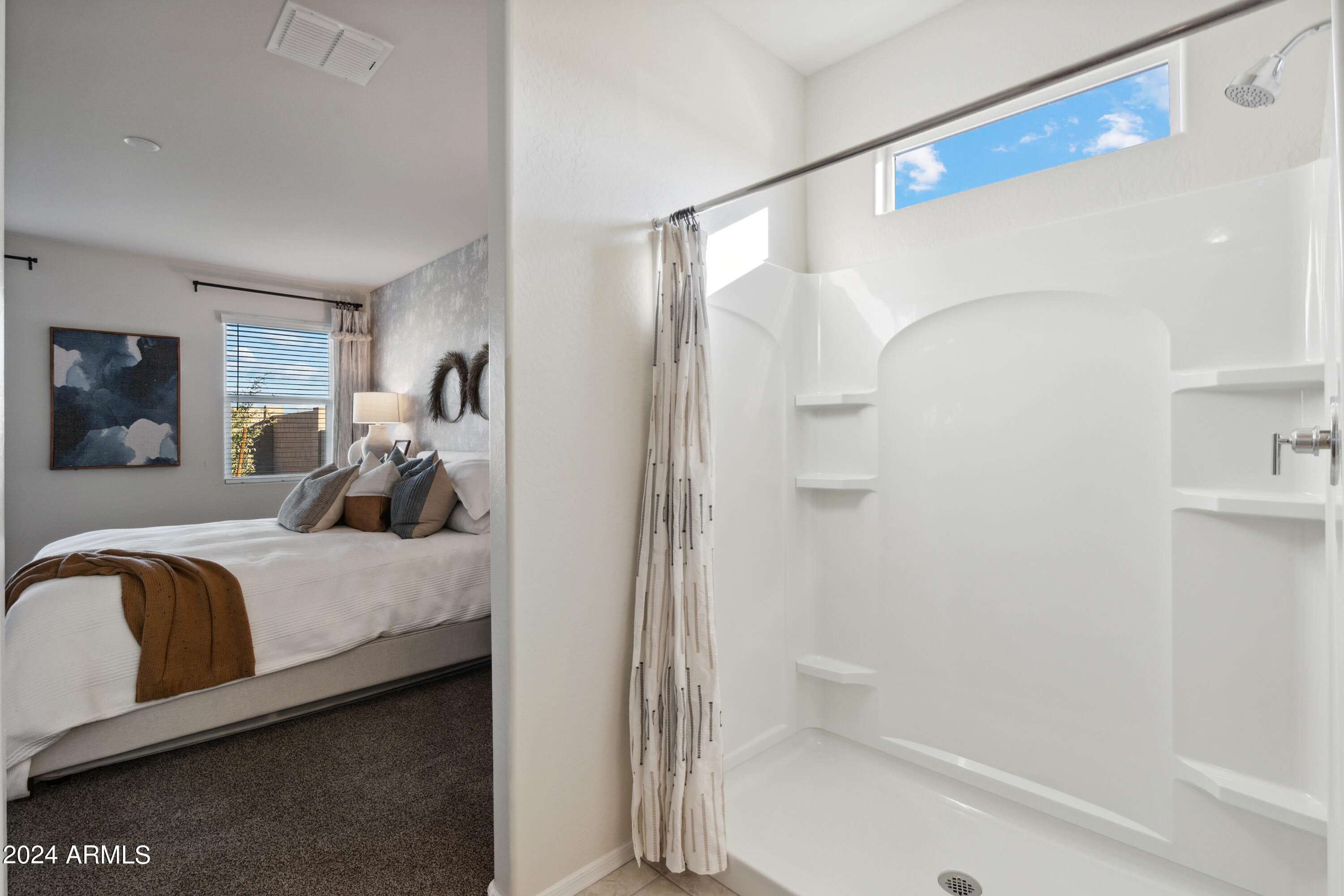 8522 West Gehrig Way Florence, AZ 85132 - Photo 16 of 46 a en suite spacious bathroom with a granite countertop sink and a mirror