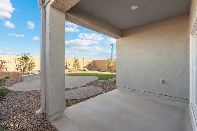 a view of a swimming pool with a patio