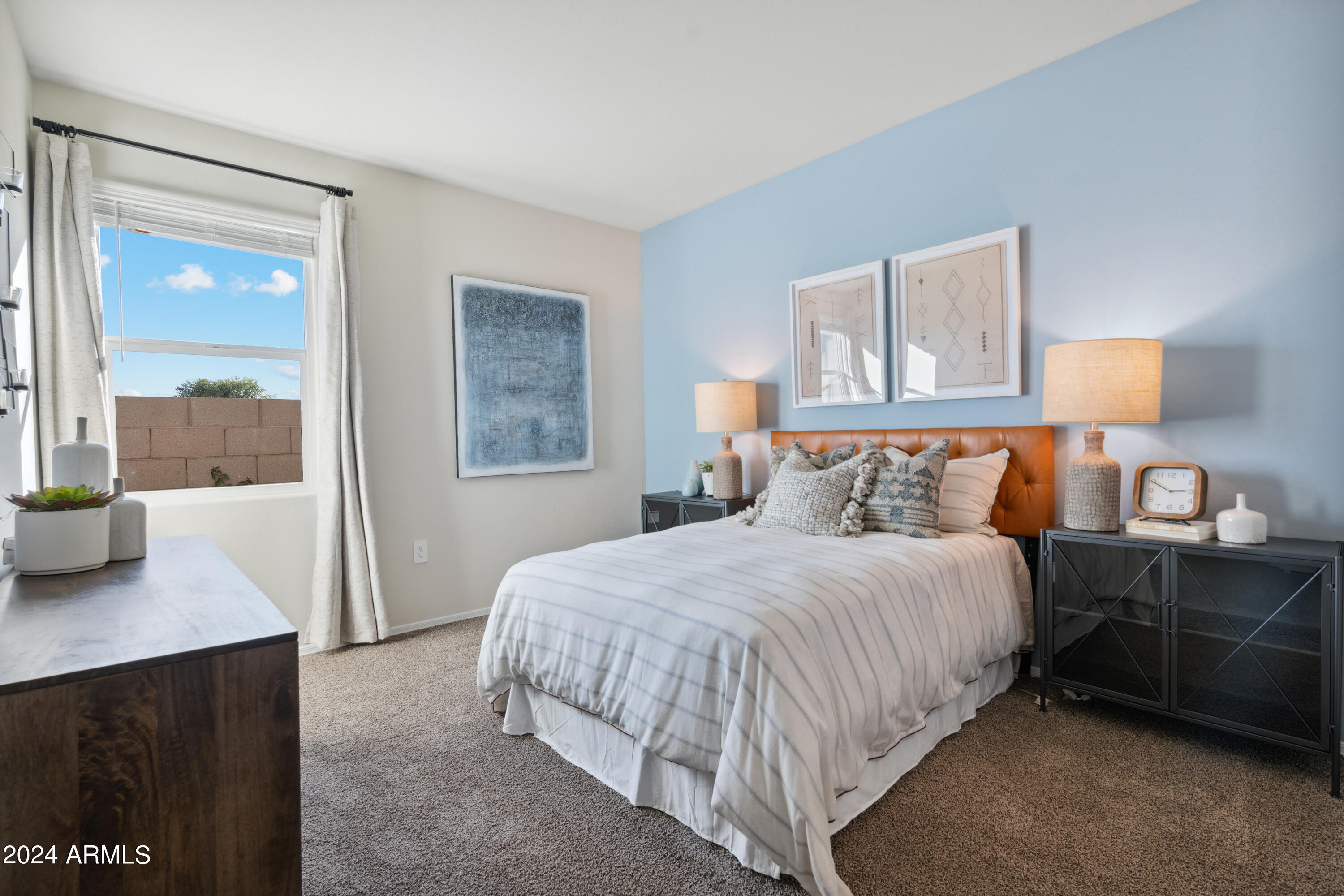 8522 West Gehrig Way Florence, AZ 85132 - Photo 10 of 46 a bedroom with a bed and a night stand