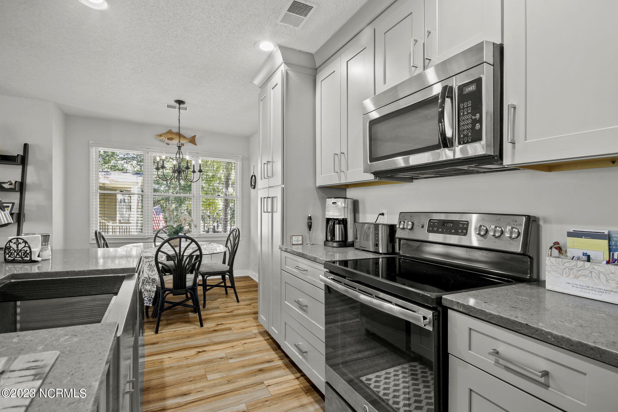 225 Clubhouse Road, Unit 706 Sunset Beach, NC 28468 - Photo 6 of 37 NEW dishwasher and Refrigerator plus new Kitchen island w/Sink and garbage disposal!
