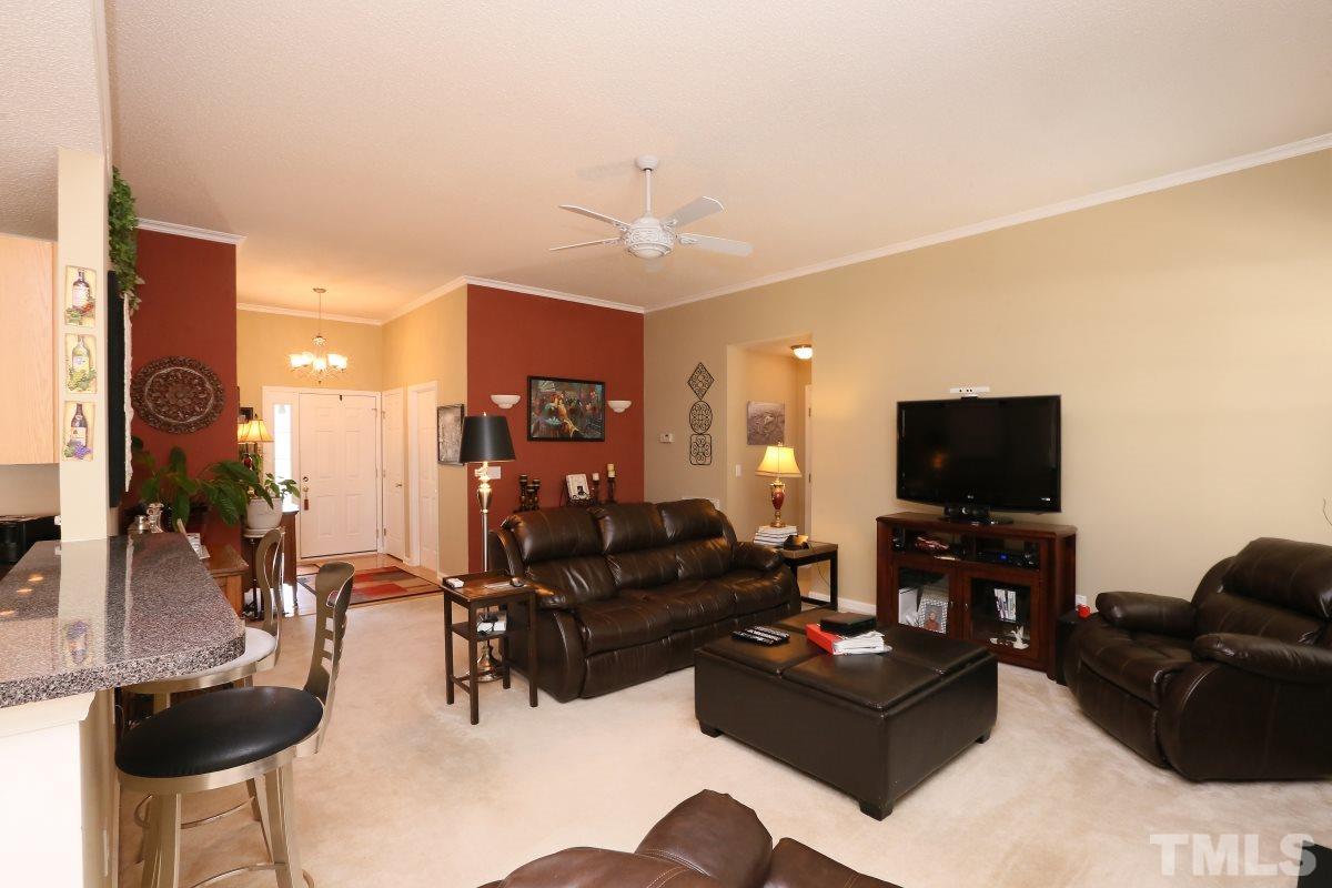 4033 Mantua Way Raleigh, NC 27604 - Photo 12 of 23 a living room with furniture and a flat screen tv