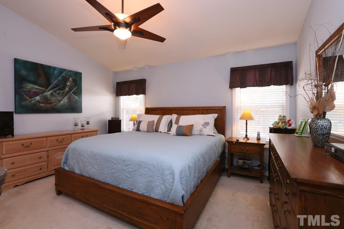 4033 Mantua Way Raleigh, NC 27604 - Photo 13 of 23 a bedroom with a bed and a flat screen tv
