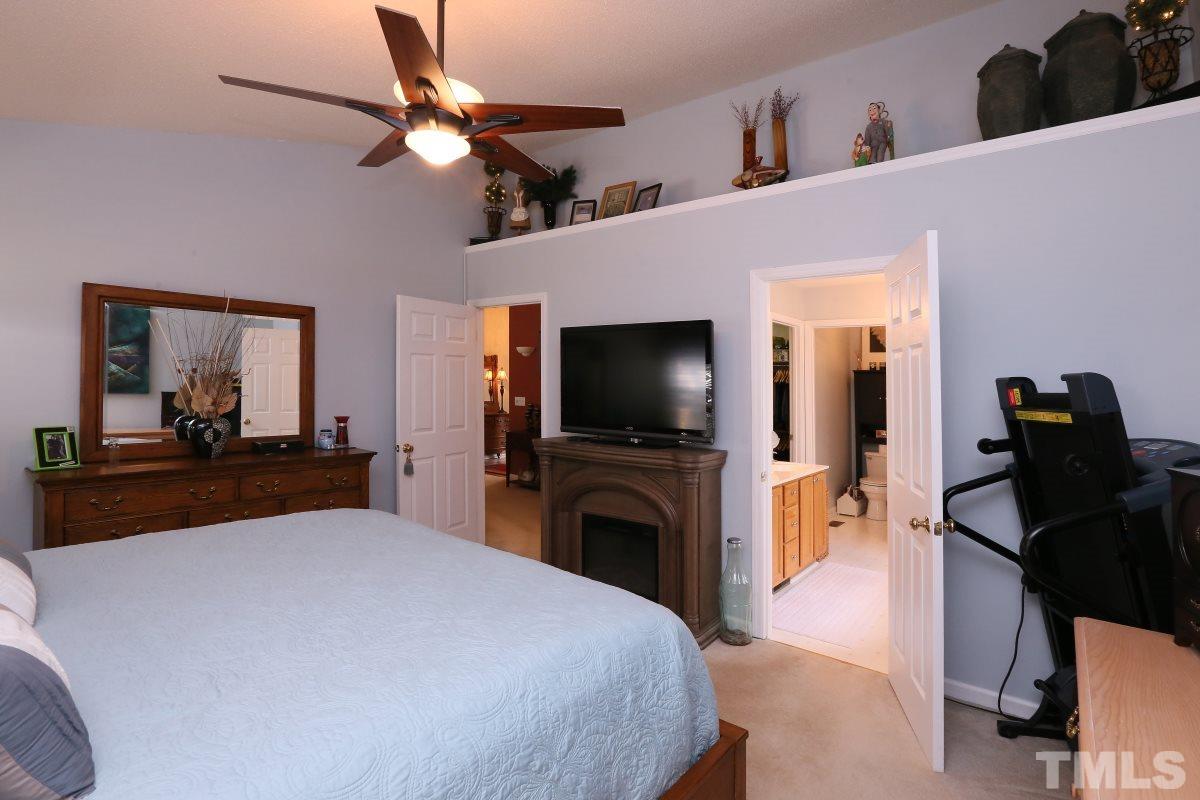 4033 Mantua Way Raleigh, NC 27604 - Photo 14 of 23 a bedroom with a bed and a flat screen tv