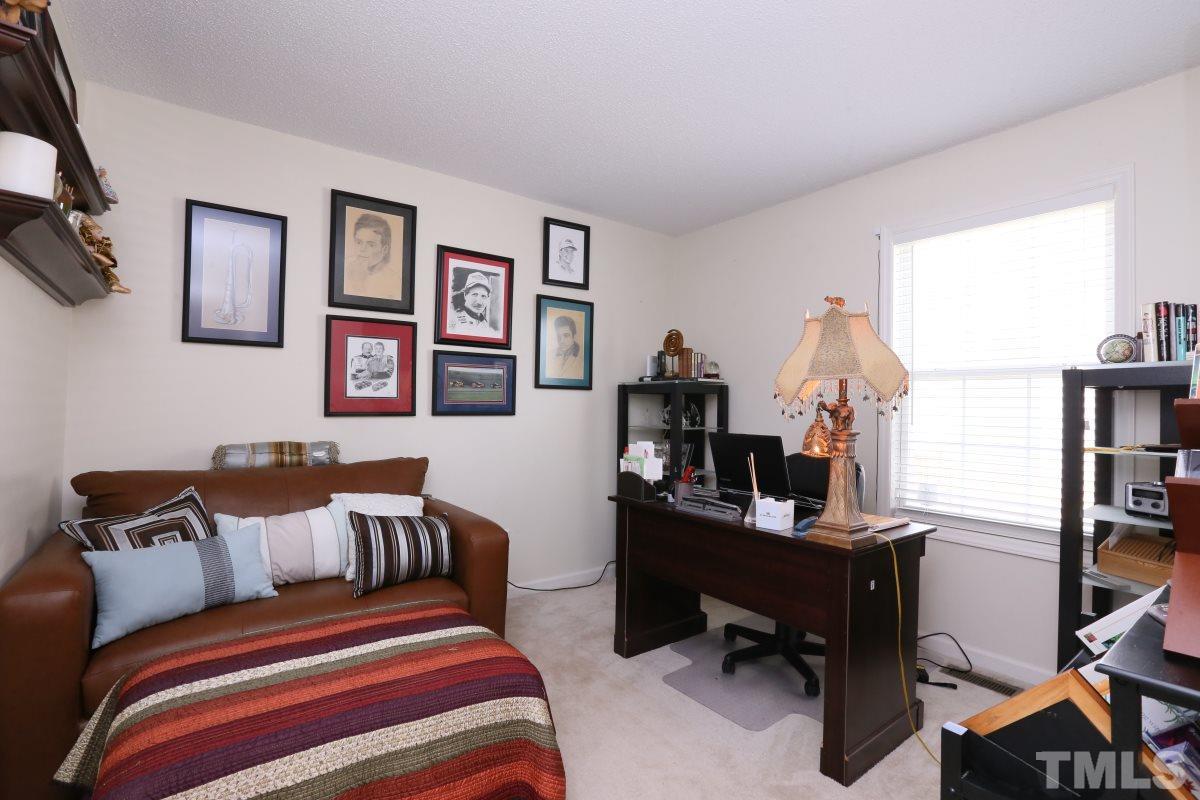 4033 Mantua Way Raleigh, NC 27604 - Photo 17 of 23 a bed room with a bed and a desk
