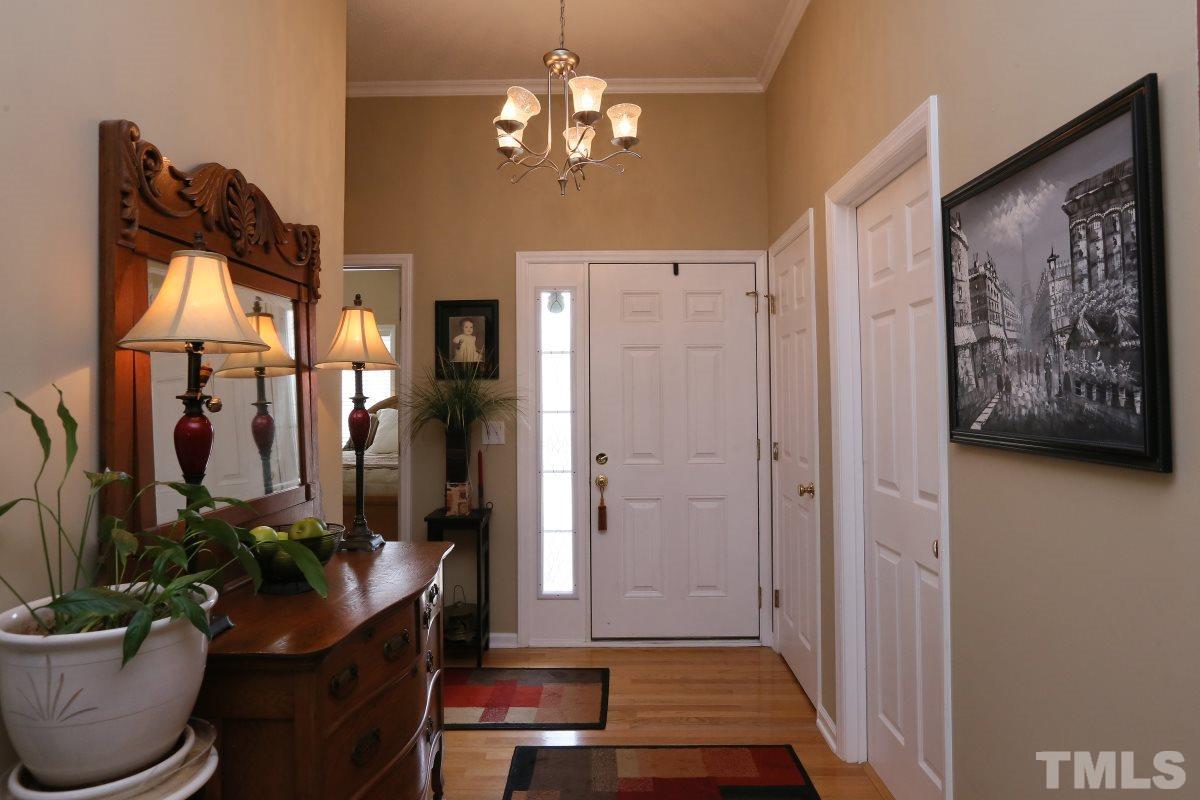4033 Mantua Way Raleigh, NC 27604 - Photo 3 of 23 a living room with furniture and a potted plant