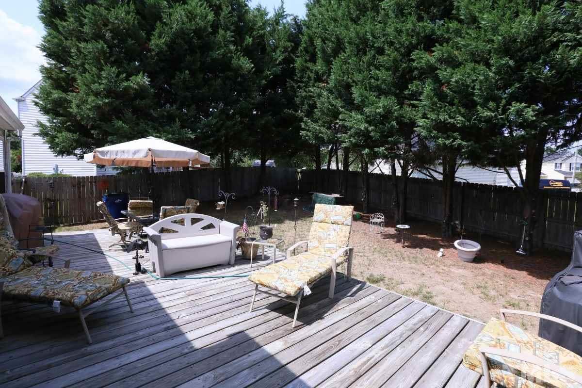 4033 Mantua Way Raleigh, NC 27604 - Photo 21 of 23 a view of backyard with seating space and trees
