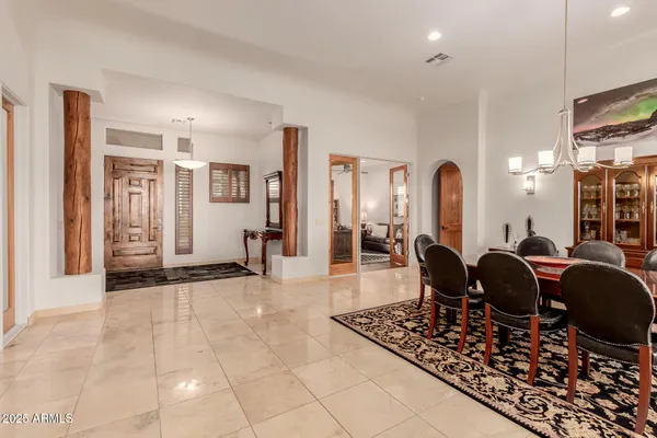 a view of a dining room with furniture window and outside view