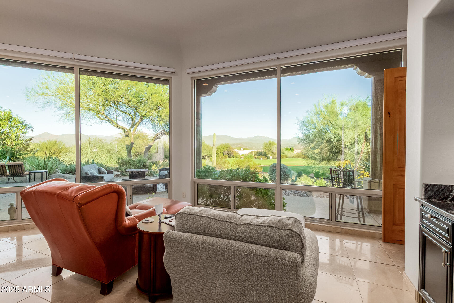 27609 Desierto Drive Rio Verde, AZ 85263 - Photo 15 of 86 a living room with a couch a table and a large window