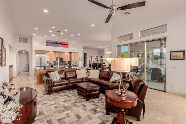 a kitchen with stainless steel appliances granite countertop a stove and a refrigerator