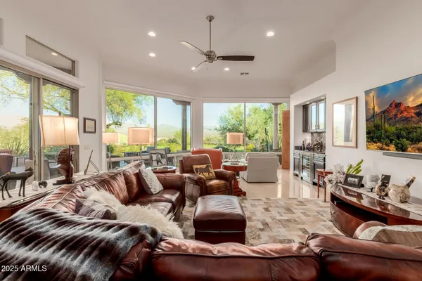 a living room with furniture and a large window