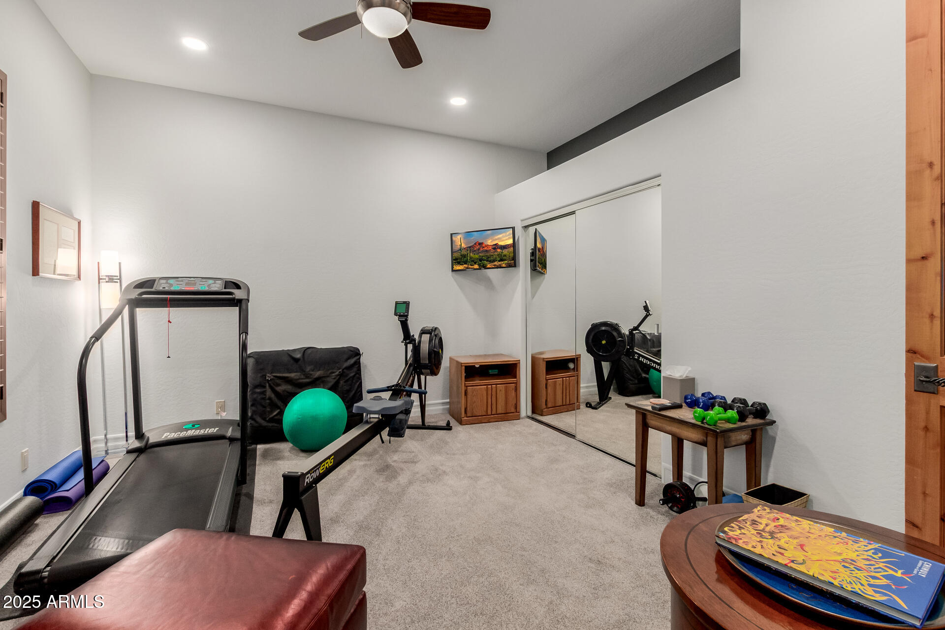 27609 Desierto Drive Rio Verde, AZ 85263 - Photo 39 of 86 a living room with furniture gym equipment and a flat screen tv