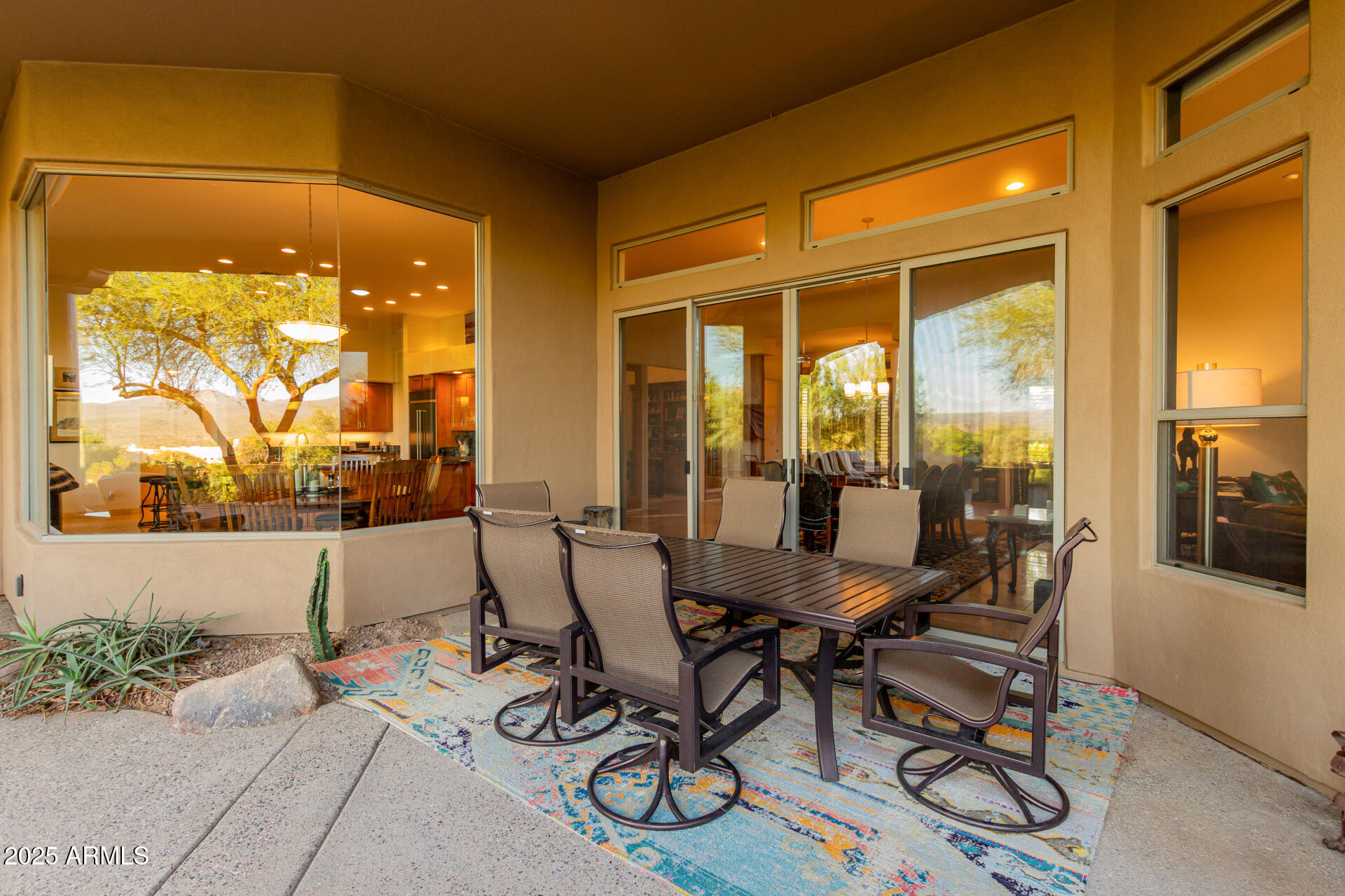 27609 Desierto Drive Rio Verde, AZ 85263 - Photo 49 of 86 a view of a patio with table and chairs and potted plants