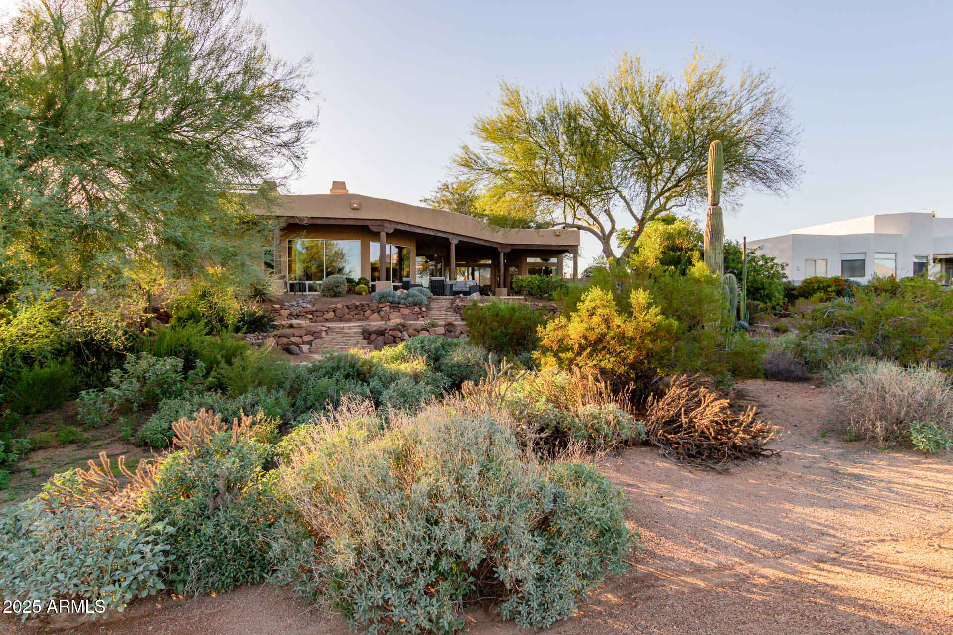 27609 Desierto Drive Rio Verde, AZ 85263 - Photo 58 of 86 a front view of a house with garden