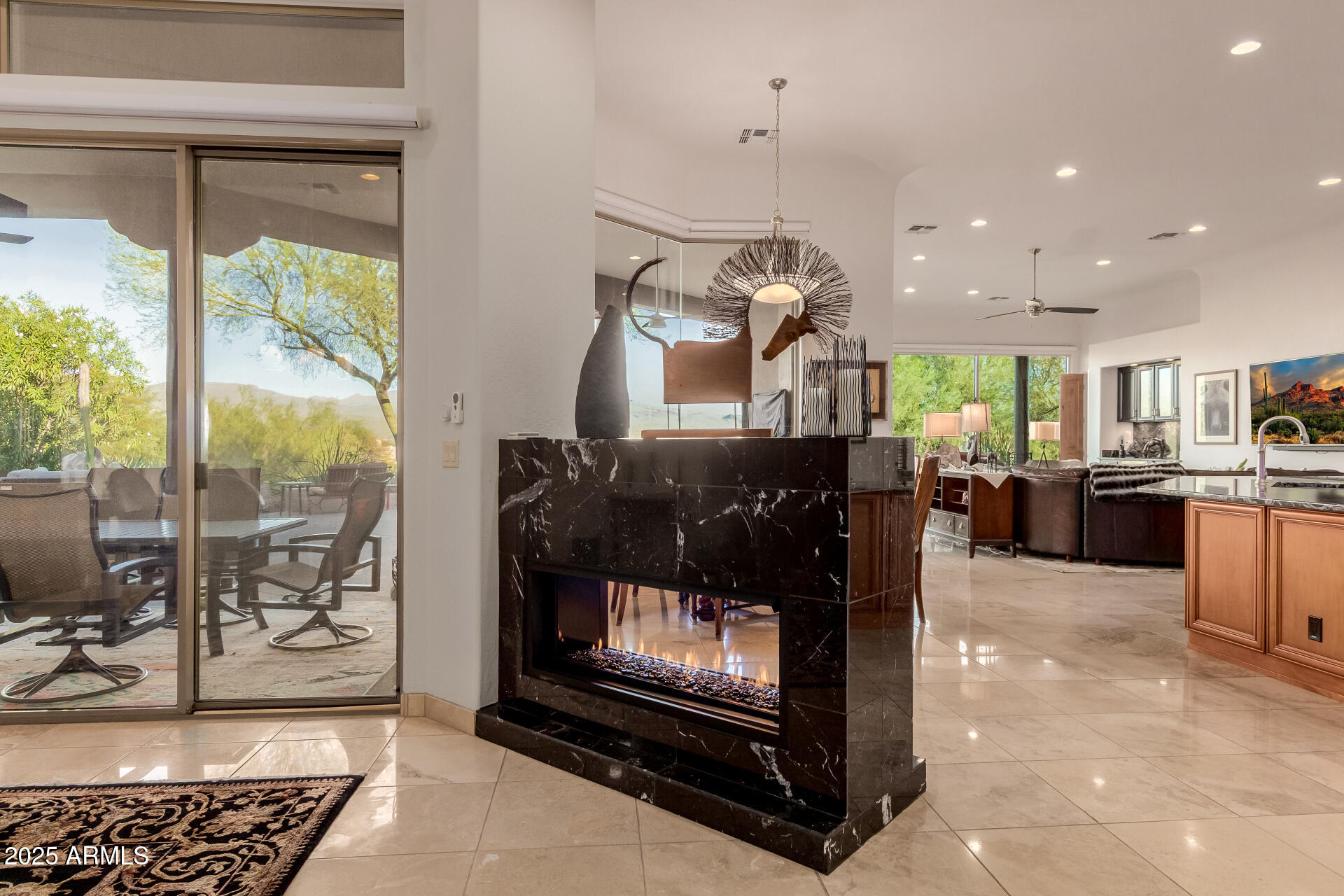27609 Desierto Drive Rio Verde, AZ 85263 - Photo 9 of 86 a living room with furniture a dining table and a fireplace
