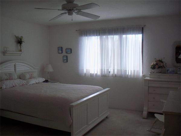 27 Cobblestone Lane, Unit 27 Worcester, MA 01606 - Photo 11 of 24 a bedroom with a bed and a window