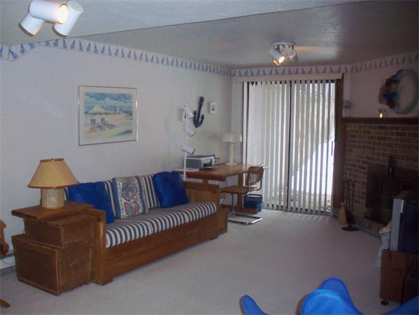 27 Cobblestone Lane, Unit 27 Worcester, MA 01606 - Photo 19 of 24 a living room with furniture a dining table and a fireplace