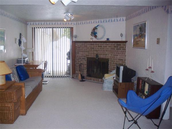 27 Cobblestone Lane, Unit 27 Worcester, MA 01606 - Photo 20 of 24 a living room with furniture and a fireplace